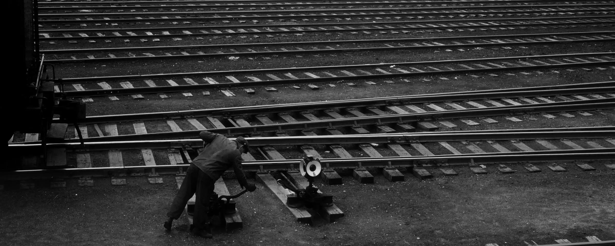 A switchman throwing a switch in a Chicago rail yard, 1943